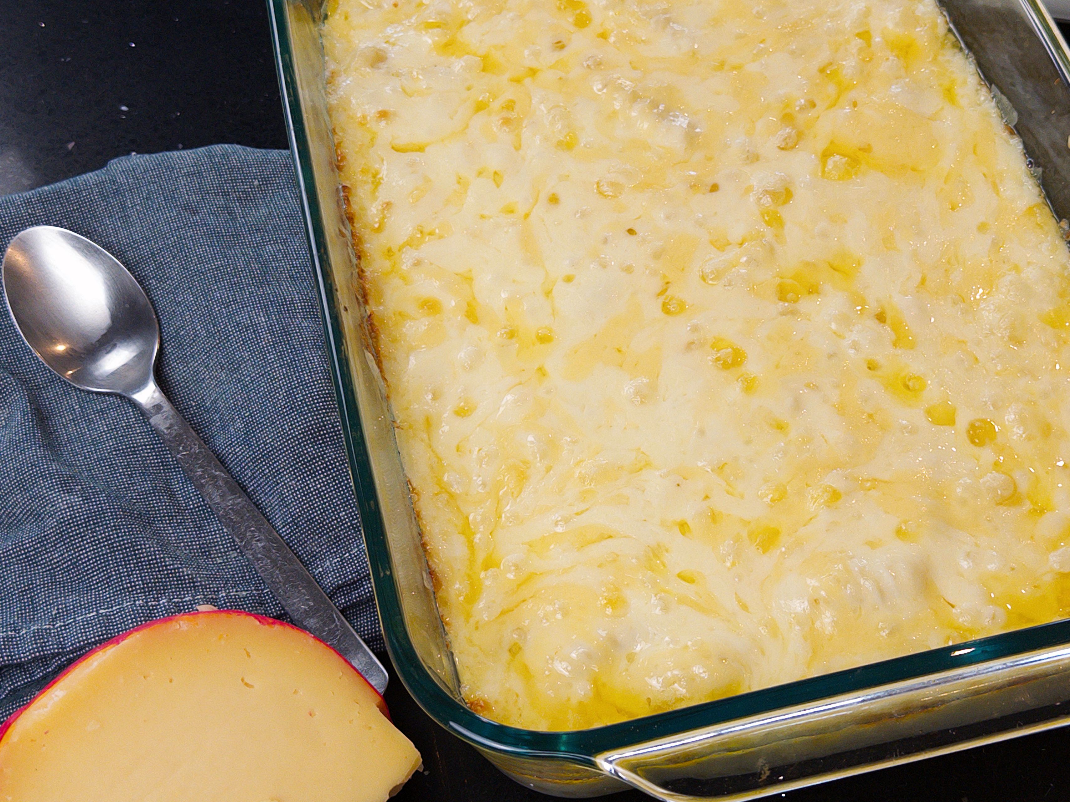 Baked mac and cheese with a browned cheesy top in a casserole dish