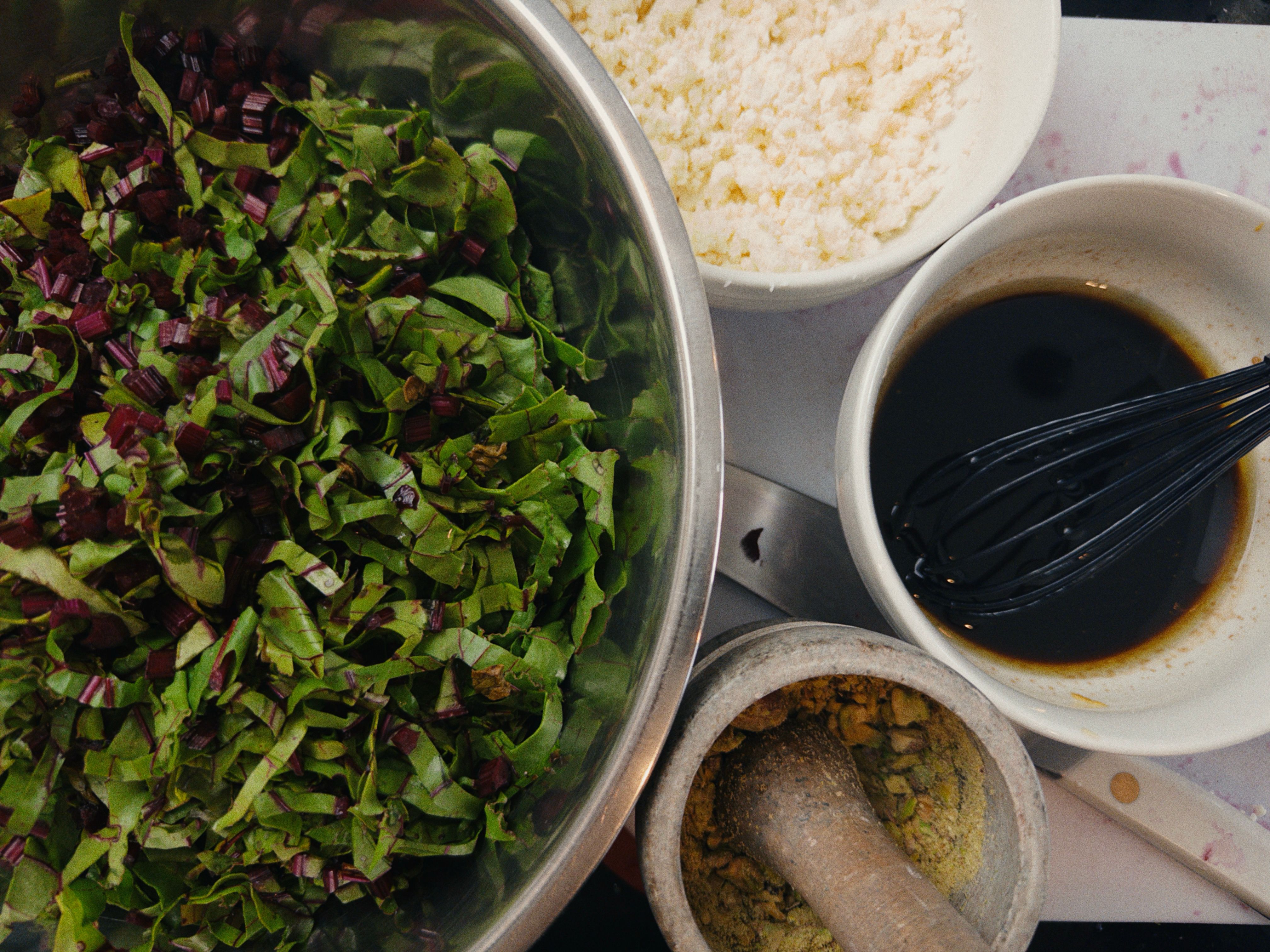 Chopped beet greens with feta, pistachios, and balsamic vinaigrette